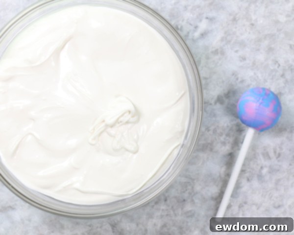 Chocolate Lollipop Ghosts - how to make edible lollipop ghosts for Halloween cakes and cupcakes using white chocolate and suckers | by Erin Gardner for TheCakeBlog.com