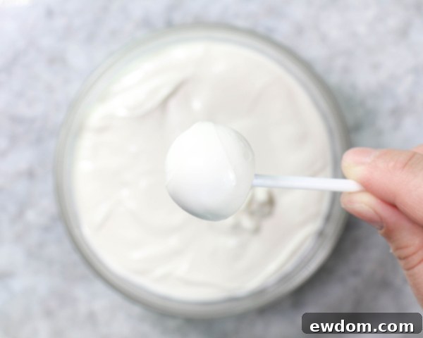 Chocolate Lollipop Ghosts - how to make edible lollipop ghosts for Halloween cakes and cupcakes using white chocolate and suckers | by Erin Gardner for TheCakeBlog.com