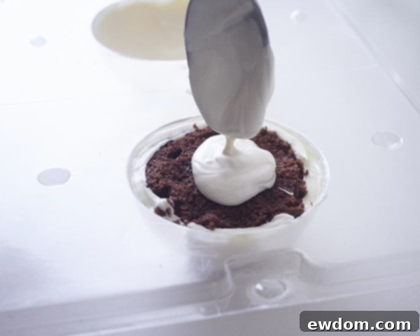 Sealing Christmas Ornament Cakes with melted candy coating