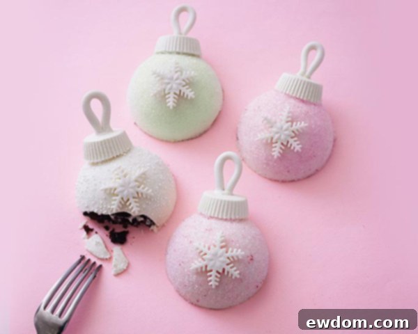 Finished sparkly Christmas Ornament Cakes ready for holiday dessert