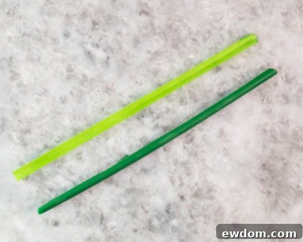 Carefully un-mold all chocolate tulip components, gathering them on a cookie sheet, ready for final cake decoration.