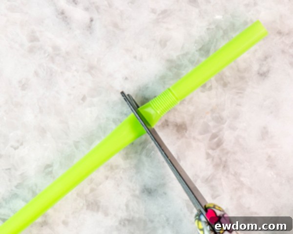 Prepare chocolate stem molds by cutting bendy straws, then slicing remaining rigid parts lengthwise into cupped pieces.