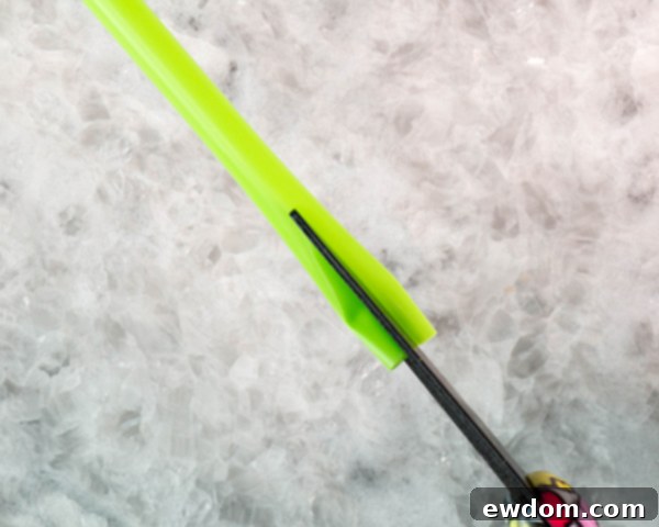 Each plastic straw yields two cupped pieces after lengthwise cutting, forming perfect molds for chocolate tulip stems.