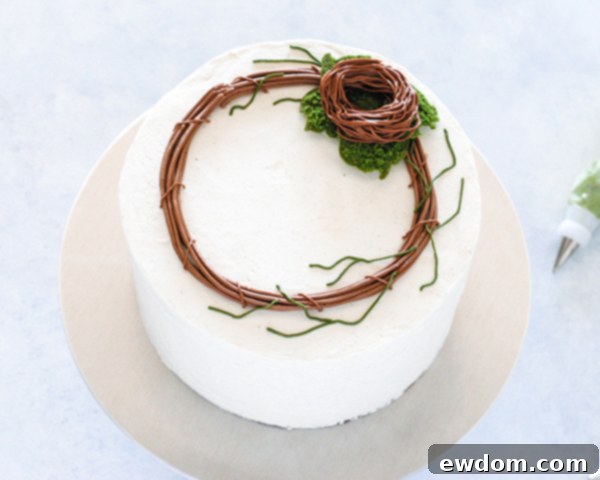 Spring Blossom Wreath Cake 13 A buttercream bird's nest piped onto the moss cookies on the Spring Wreath Cake, with an indentation for eggs.