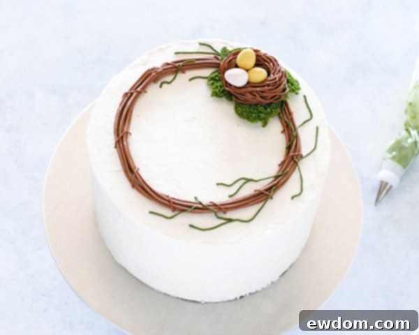 Spring Blossom Wreath Cake 14 Cadbury Mini Eggs placed inside the buttercream bird's nest on the Spring Wreath Cake, adding a charming detail.
