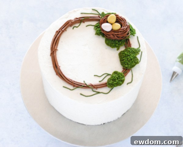 Spring Blossom Wreath Cake 15 Additional moss cookies and piped buttercream leaves added to the Spring Wreath Cake, building the wreath's volume.