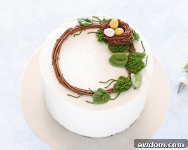 Spring Blossom Wreath Cake 16 Close-up of the Spring Wreath Cake with a dense arrangement of buttercream leaves, creating a vibrant spring display.