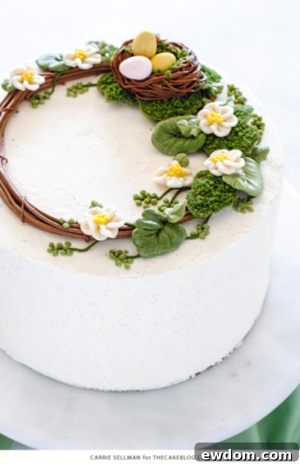 Spring Blossom Wreath Cake 5 A side shot of the elegantly decorated Spring Wreath Cake, ready to be served at any festive spring occasion.