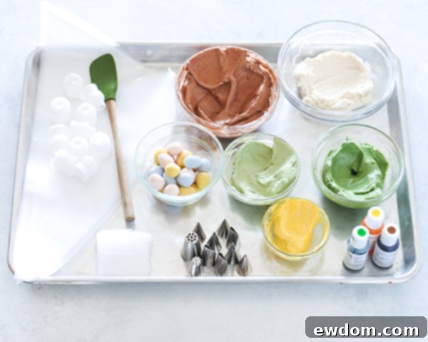 Spring Blossom Wreath Cake 6 Bowls of perfectly tinted buttercream in green, brown, yellow, and white, ready for cake decoration.