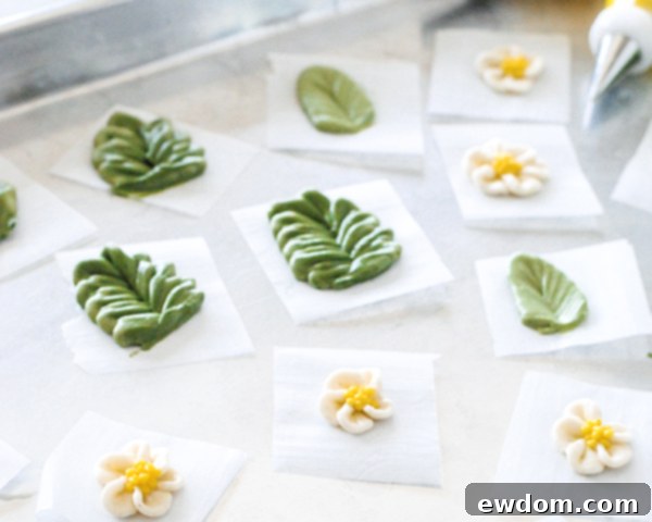 Spring Blossom Wreath Cake 9 Close-up of freshly piped buttercream cherry blossoms with yellow centers, showcasing the delicate details before chilling.