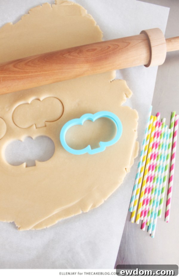 Rows of freshly baked Bunny Face Cookie Pops, waiting for their royal icing decoration