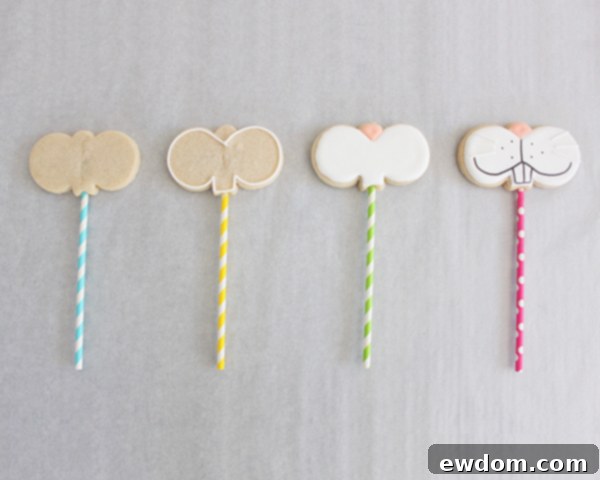 A closer view of undecorated bunny sugar cookie shapes with sticks inserted, ready for the oven
