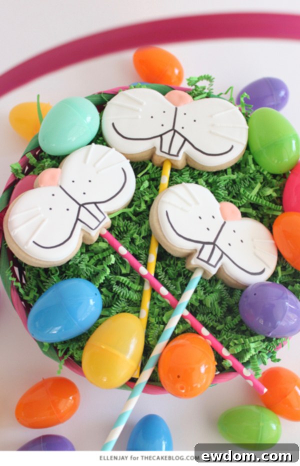 A freshly baked Bunny Face Cookie with a paper straw inserted, cooling on a wire rack