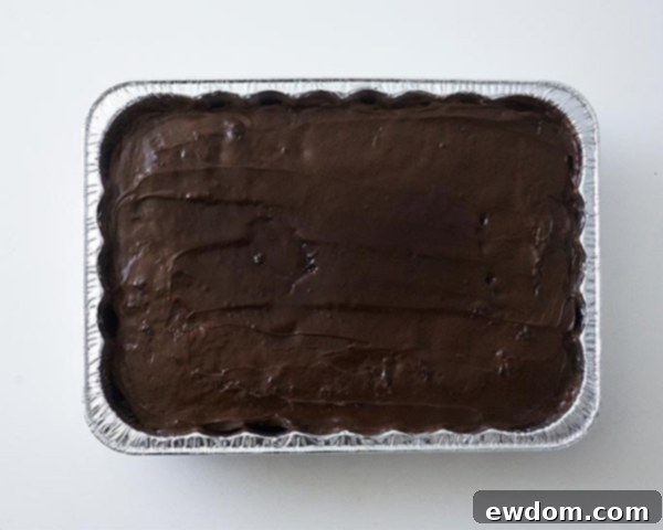 Mid-Century Meal Cake 6 Cake base for TV Dinner Cake: a chocolate-frosted sheet cake baked in an aluminum pan. First step for an easy and fun Father's Day or April Fools Day dessert. By Cakegirls for TheCakeBlog.com