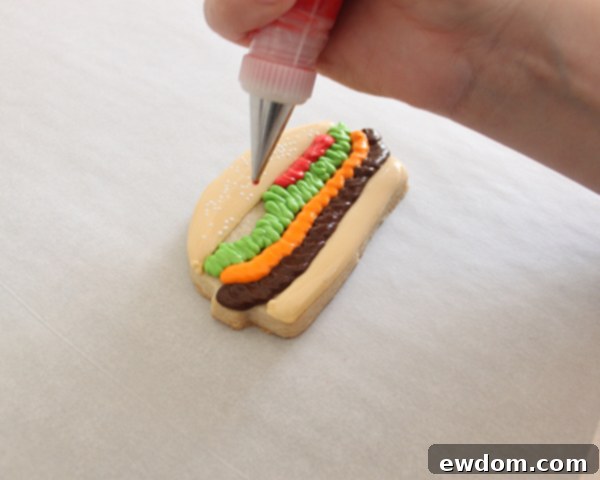 Final decorated hamburger sugar cookie showing all steps