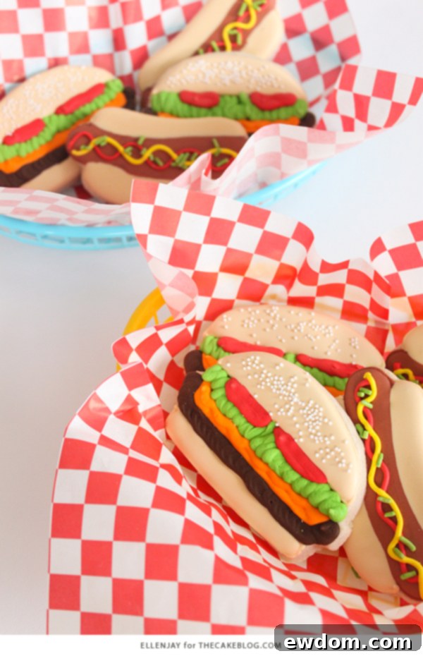 Assortment of decorated hamburger and hot dog sugar cookies on a platter