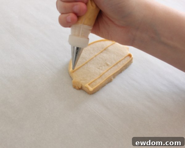 Flooding hamburger buns with ivory royal icing