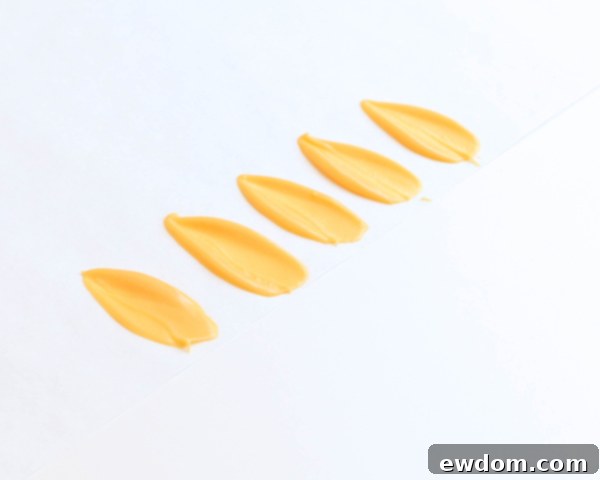 Sunflower Cake - how to make gorgeous sunflower cake decorations using melted chocolate | by Erin Gardner for TheCakeBlog.com