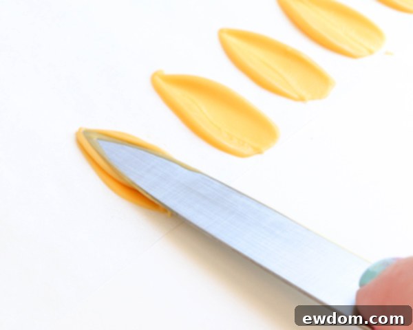 Sunflower Cake - how to make gorgeous sunflower cake decorations using melted chocolate | by Erin Gardner for TheCakeBlog.com