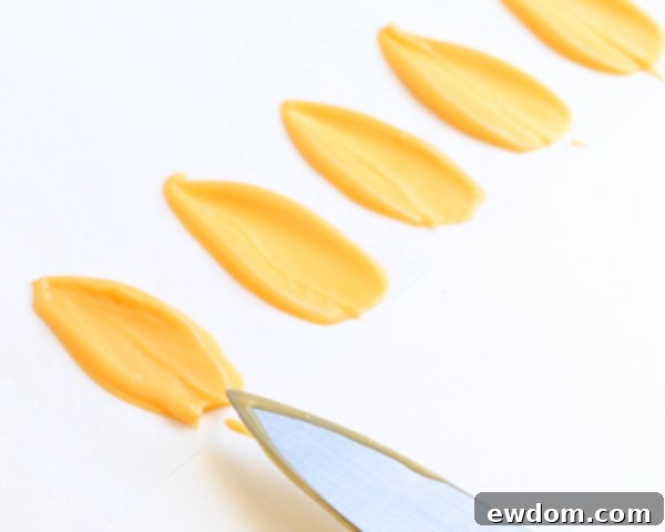 Sunflower Cake - how to make gorgeous sunflower cake decorations using melted chocolate | by Erin Gardner for TheCakeBlog.com