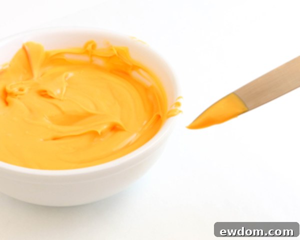 Sunflower Cake - how to make gorgeous sunflower cake decorations using melted chocolate | by Erin Gardner for TheCakeBlog.com