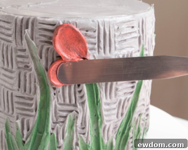 Adding a second buttercream petal, overlapping the first for a natural flower shape