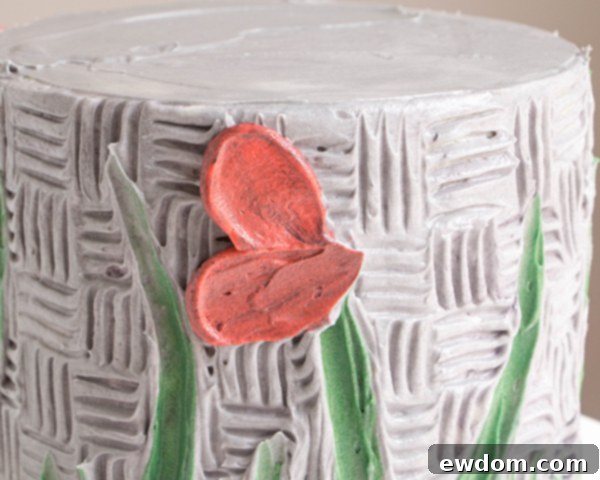 Developing the flower form with multiple overlapping buttercream petals