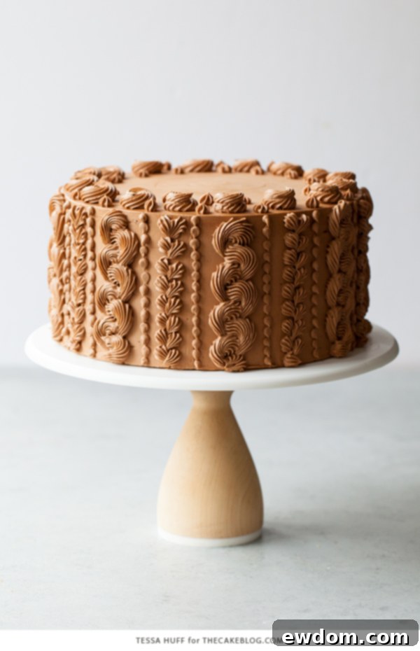 Golden Toffee Crunch Chocolate Cake 11 A top-down view of the Chocolate Toffee Crunch Cake with intricate piping