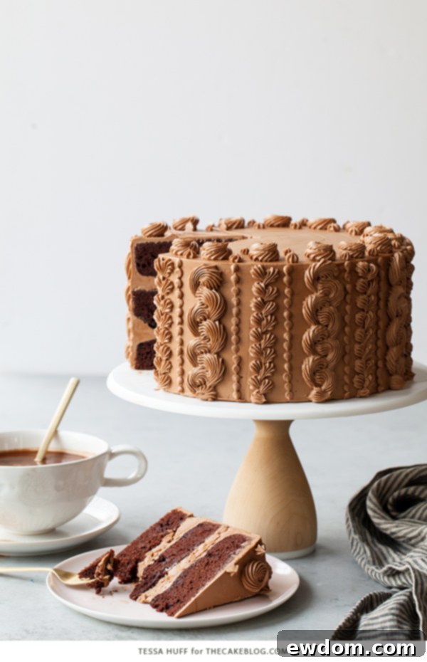 Golden Toffee Crunch Chocolate Cake 4 A slice of Chocolate Toffee Crunch Cake revealing layers of moist cake, buttercream, and toffee