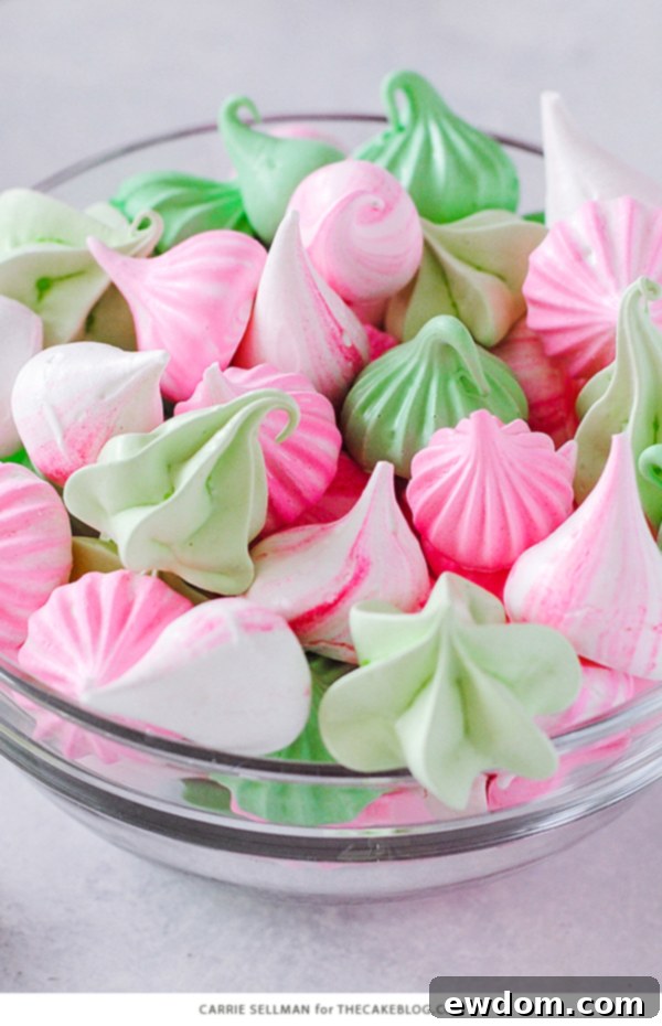 A festive assortment of Meringue Kisses in various colors, perfect for holiday gifting or dessert platters.