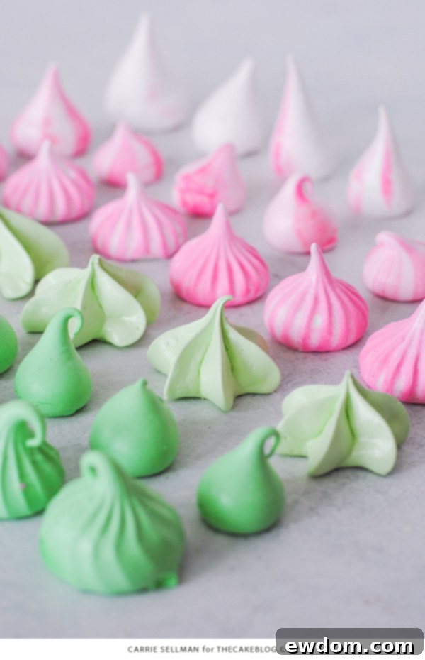 Sweet Whispers 7 Meringue Kisses - Melt-in-your-mouth mini meringue cookies that are light as air, naturally low calorie, dairy free, gluten free, and soy free. A beautiful display of multi-colored meringue kisses on a white plate. | by Carrie Sellman for TheCakeBlog.com