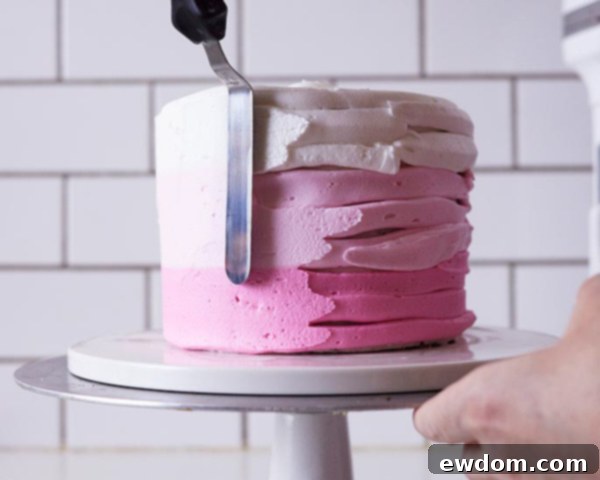 XOXO Valentine's Day Cake - how to make a pink ombre striped cake decorated with chocolate lips, hearts and an XOXO topper | by Cakegirls for TheCakeBlog.com