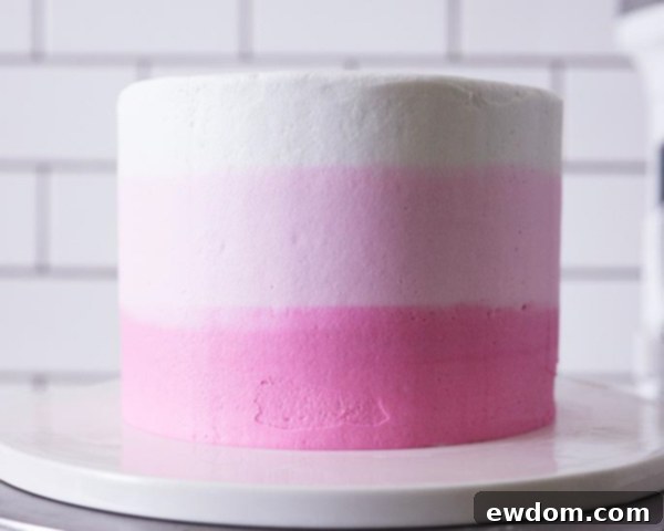 XOXO Valentine's Day Cake - how to make a pink ombre striped cake decorated with chocolate lips, hearts and an XOXO topper | by Cakegirls for TheCakeBlog.com