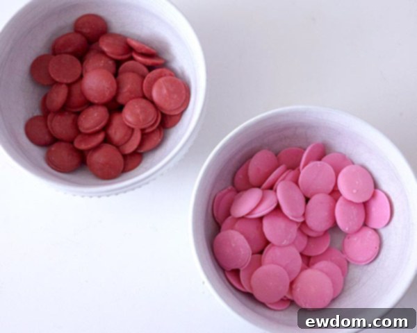 XOXO Valentine's Day Cake - how to make a pink ombre striped cake decorated with chocolate lips, hearts and an XOXO topper | by Cakegirls for TheCakeBlog.com