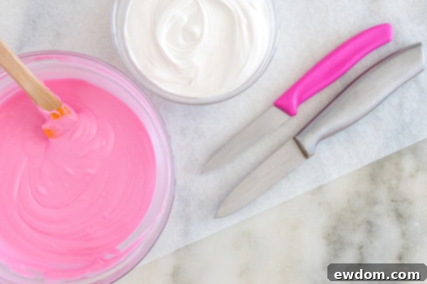 Melted white chocolate in a small bowl with a knife, ready for the ear-making process.