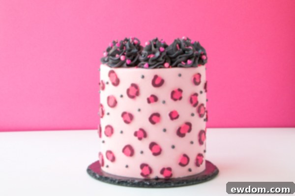 Chic Leopard Buttercream 16 Decorating the top of the leopard print cake with sprinkles and pearls