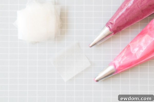 Chic Leopard Buttercream 6 Different shades of pink buttercream in piping bags with waxed paper squares