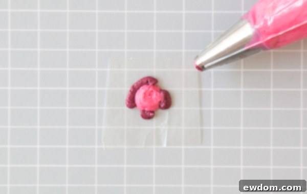 Chic Leopard Buttercream 8 Filling in the center of a buttercream leopard spot with fuchsia frosting