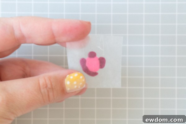 Chic Leopard Buttercream 9 Detailed view of multiple piped buttercream leopard spots on waxed paper