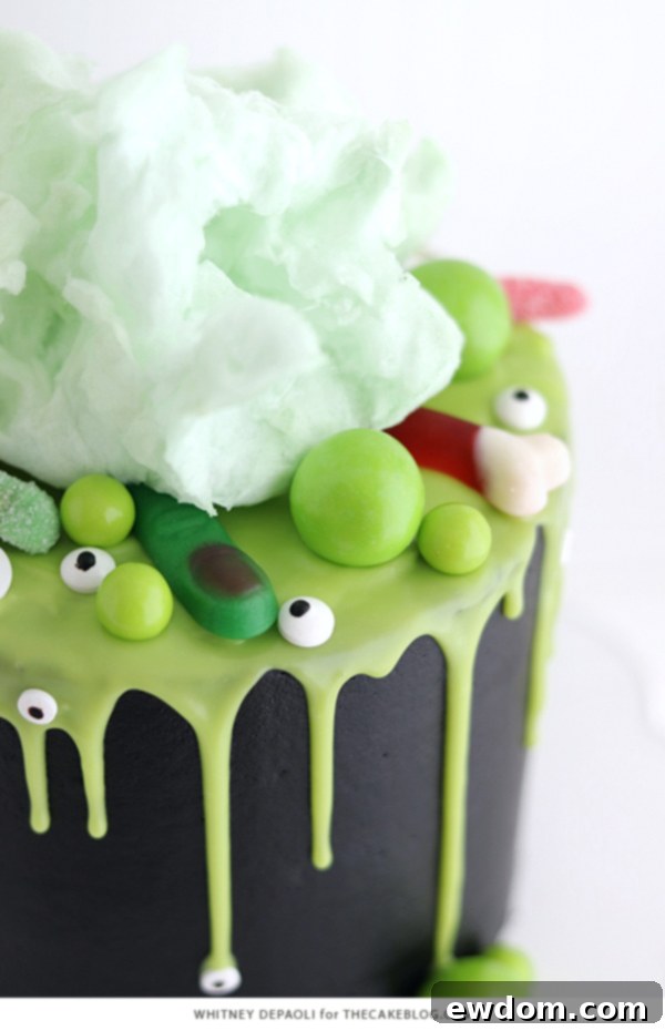 Sorceress's Potion Cake 6 Witch Cauldron Cake with green ganache drips and various gummy candies