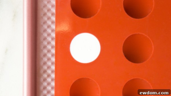 Gazing Chocolate Blossom 13 Chocolate Eyeball Flower - how to make a creepy black chocolate flower with an edible eyeball center | by Erin Gardner for TheCakeBlog.com