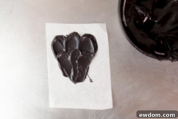 Gazing Chocolate Blossom 7 Chocolate Eyeball Flower - how to make a creepy black chocolate flower with an edible eyeball center | by Erin Gardner for TheCakeBlog.com