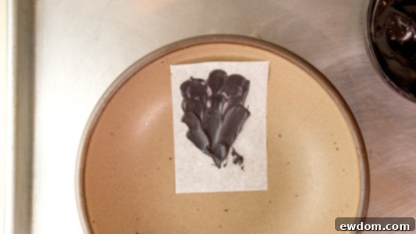 Gazing Chocolate Blossom 8 Chocolate Eyeball Flower - how to make a creepy black chocolate flower with an edible eyeball center | by Erin Gardner for TheCakeBlog.com