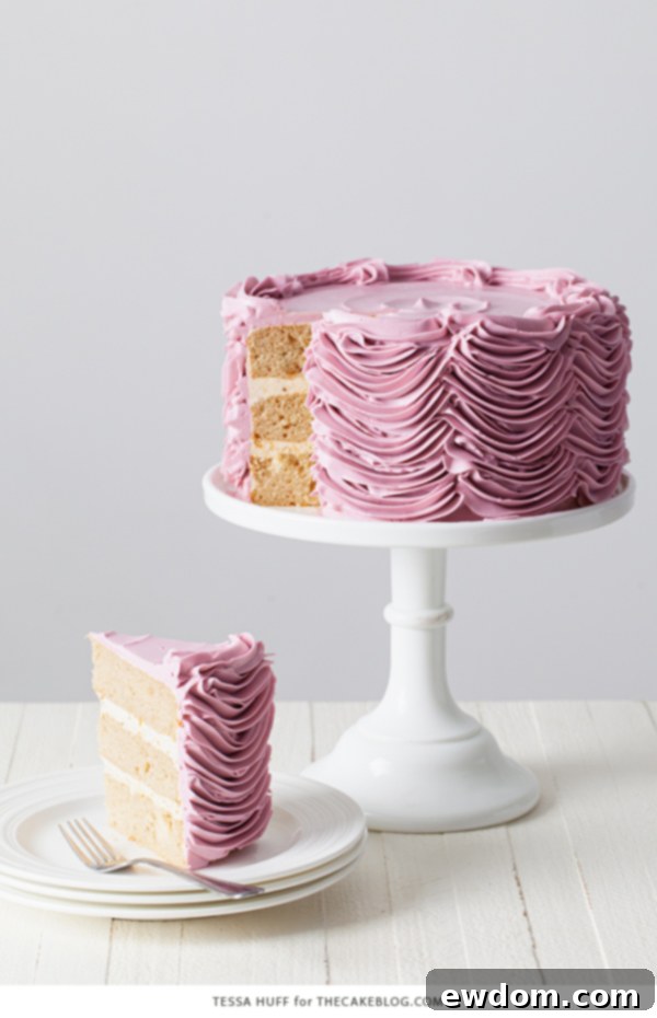 Enchanted Hazelnut Nutcracker Cake 5 Hazelnut Nutcracker Cake decorated with elegant buttercream swags and festive toppers.