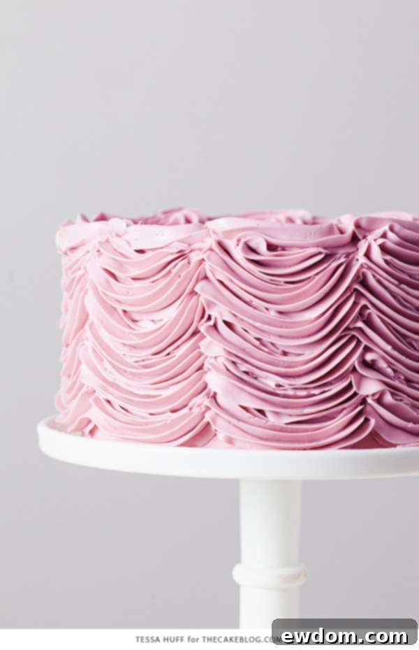 Enchanted Hazelnut Nutcracker Cake 7 A side view of the elegant Hazelnut Nutcracker Cake, showcasing the detailed buttercream piping.