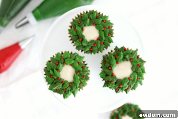 Festive Wreath Cupcakes 15 Four finished berry wreath cupcakes displayed together