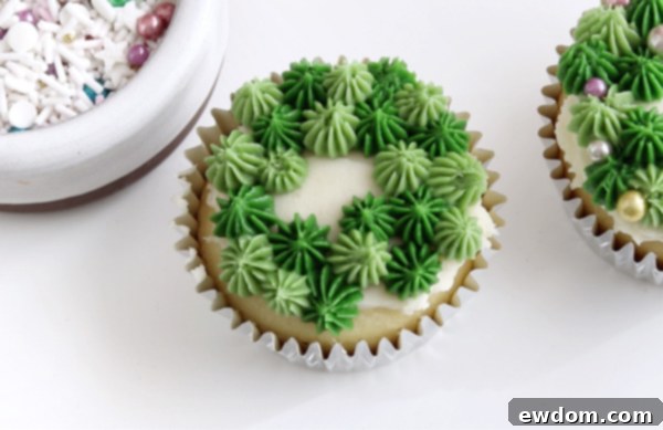 Festive Wreath Cupcakes 21 Filling in gaps with a second shade of green drop stars
