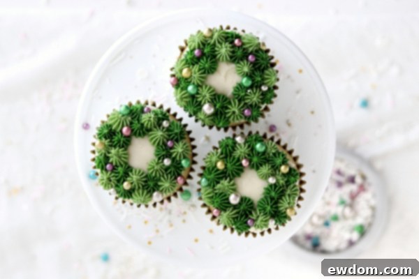 Festive Wreath Cupcakes 23 Four finished sprinkled wreath cupcakes with colorful sprinkles