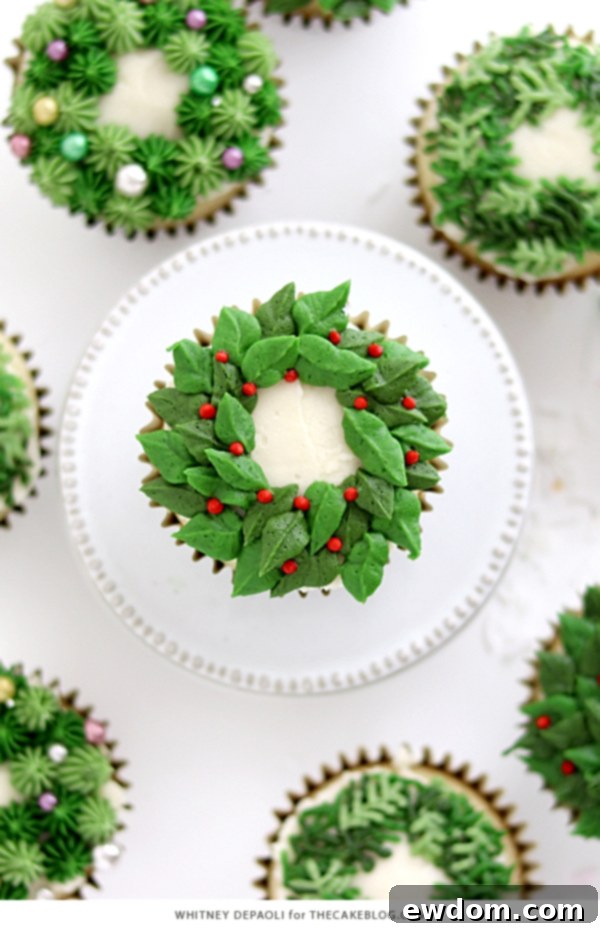 Festive Wreath Cupcakes 4 Close-up of three distinct Christmas wreath cupcake designs