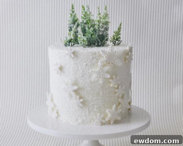 Enchanted Snowflake Cake 17 The finished Winter Wonderland Snowflake Cake as a stunning centerpiece